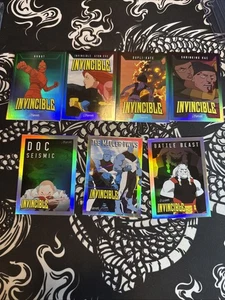 Invincible Keepsake 7 Karten Holo Foil Short Printed Lot Doc Mauler Dupli-Kate etc - Bild 1 von 2