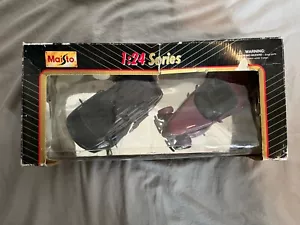 Maisto Black Plymouth Voyager and Purple PT Cruiser 1:24 - Picture 1 of 6