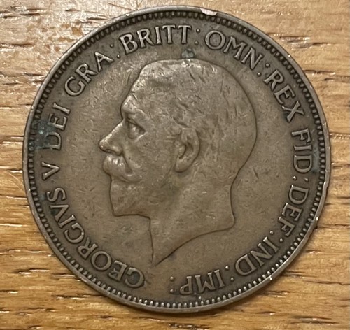 1936 George V penny showing right-facing profile with text “GEORGIUS V DEI GRATIA: BRITT: OMN: REX: FID: DEF: IND: IMP:”