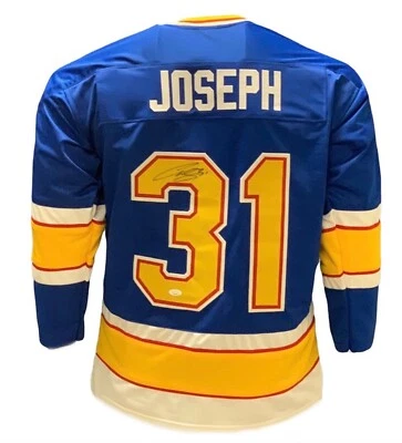 Camiseta deportiva de hockey estilo profesional firmada autografiada por Curtis Joseph azul (JSA) Foto 1 de 3