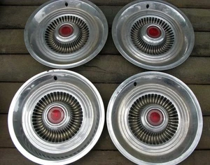 SET OF FOUR USED STAINLESS STEEL ORIGINAL HUBCAPS CHEVY PONTIAC ? CHEVROLET GM ! - Picture 1 of 8