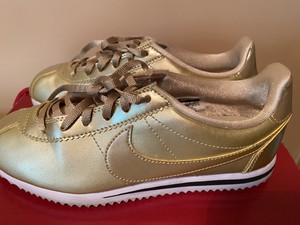 gold nike cortez womens
