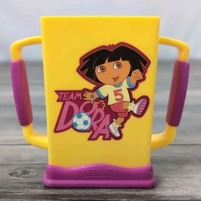 Munchkin Dora The Explorer Grip 'n Sip Juice Box Carrier Nickelodeon Amarillo Foto 1 de 4
