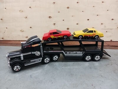 Portacarros Buddy L Kenworth Big Brute Sound con remolque y 2 Nascar Monte Carlo Foto 1 de 4