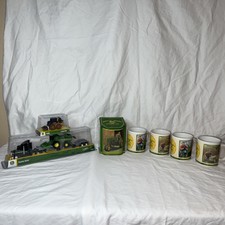 John Deere Lot: Tomy Hauler Semi ERTL 318E skid steer. John Deere Tin, 4 mugs