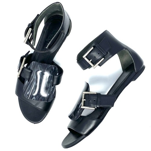 SANDALI GLADIATORE ALEXANDER MCQUEEN FLAT NERI DETTAGLIO FIBBIA TARTARUGA
