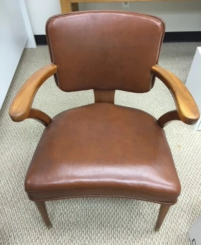 Vintage 1960s W.H. Gunlocke chair; Walnut with vinyl upholstery Cover