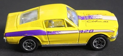 Matchbox 68 Ford Mustang Cobra Jet 1:60 Yellow Purple Stripe Diecast - Image 1 of 4