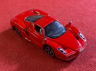 BBURAGO Modellino Auto ENZO FERRARI Metallo Rosso 1:64 - Immagine 1 di 3