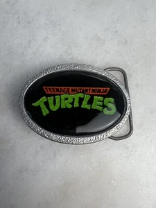 Teenage Mutant Ninja Turtles Gürtelschnalle Schwarz Silber Logo - Bild 1 von 4