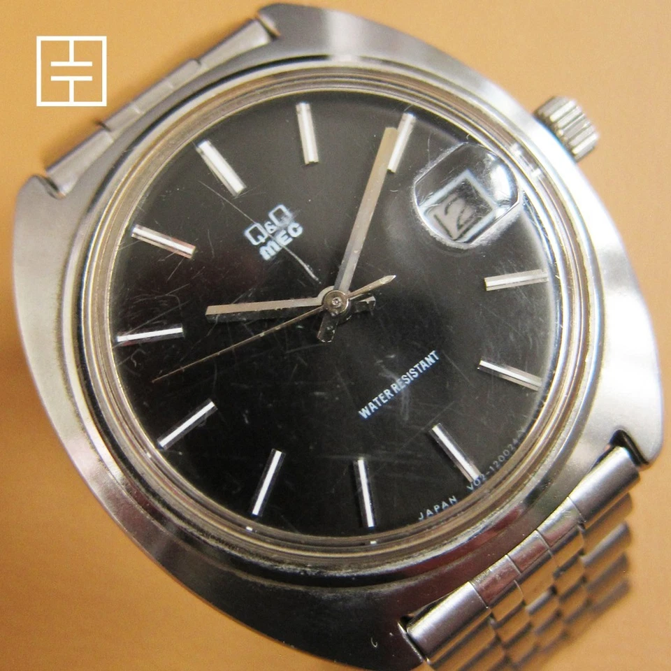 Reloj mecánico Q&Q (Citizen) MEC Y02-120027 con esfera negra (HECHO EN JAPÓN) Foto 1 de 4