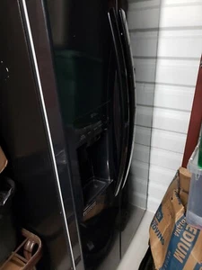 LG Black Refrigerator and Oven - Picture 1 of 3