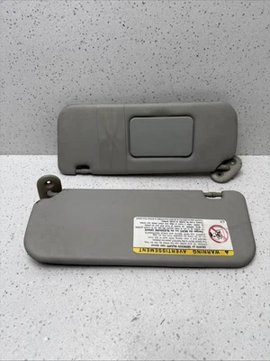 Par de parasol lado conductor y pasajero Toyota Corolla 2003-2008 OEM Foto 1 de 4