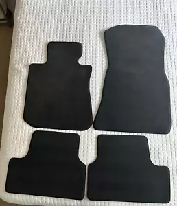 BMW I4 BLACK OEM STOCK FLOOR MATS FRONT AND REAR 4 PIECES - Picture 1 of 5