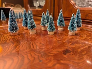 Ten 2 3/8" & 2" Tall Bottle Brush Evergreen Snow-tip Trees w/ Natural Wood Bases - Picture 1 of 5
