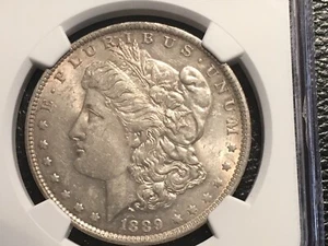 1889-O morgan dollar NGC 58 AU looks unc. nice gold toning - Picture 1 of 5