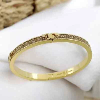 Brazalete Brazalete Tory Burch Serif T Pave Bisagras en Tono Dorado. Venta al por menor $198 Foto 1 de 4