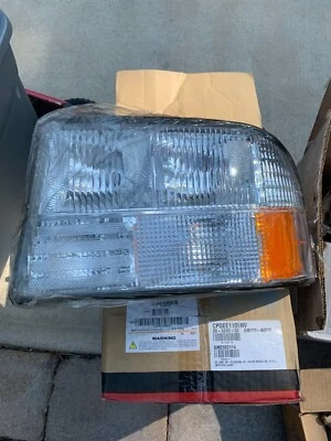 Conjunto de faros para GMC Jimmy 1998-2005 6 cilindros 4,3 L con bombilla halógena (para: 1 Foto 1 de 2