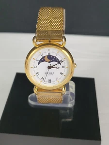 Vintage BECORA SWISS QUARZUHR DAMEN MOND GOLDFARBEN DATUM ANALOG LÄUFT - Bild 1 von 8