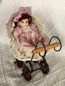 Porcelain Doll with Wicker Carriage - Picture 1 of 12