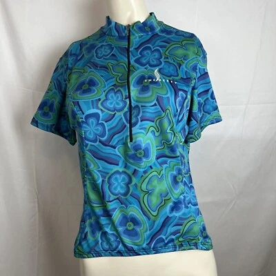 Camiseta deportiva de ciclismo Shebeest para mujer media cremallera manga corta azul floral dañada L Foto 1 de 4