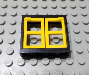LEGO Black 1x4x3 Window with Yellow Panes - Picture 1 of 1