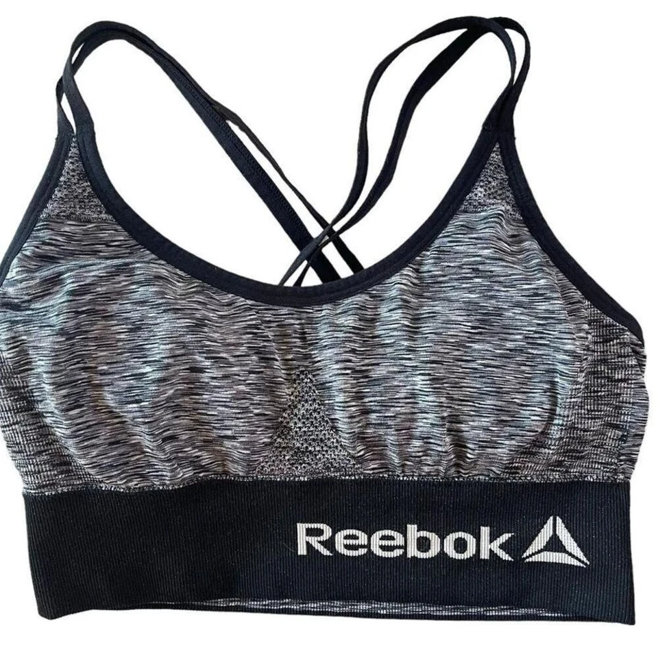 Sujetador deportivo Reebok tirantes cruzados pequeños. Negro y gris, ropa de entrenamiento Sm Foto 1 de 4