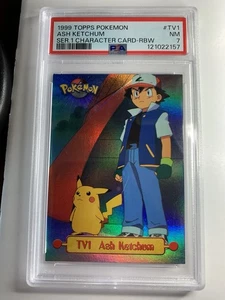 1999 Topps Pokemon #TV1 Ash Ketchum & Pikachu Rainbow Foil Blue Logo PSA 7 NM B - Picture 1 of 3