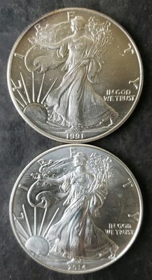 1991 and 2014 $1 American Silver Eagle Dollars - Image 1 of 3