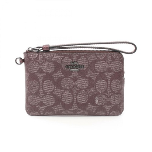 Borsa a marsupio Coach Signature con zip angolare da polso rivestita in PVC tela pelle donna