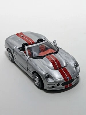  SHELBY  New Ray 2000 SHELBY SERIES 1  Convertible  Silver w/Red Stripes   1:32  - Image 1 of 4
