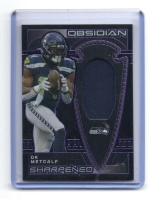 2023 Panini Obsidian - Sharpened Swatches  DK Metcalf 11 and 23/75 PURP SEAHAWKS - Image 1 of 3