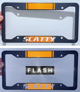 Reflective Orange Scatty Metal Carbon Fiber Look License Plate Frame - Picture 1 of 5