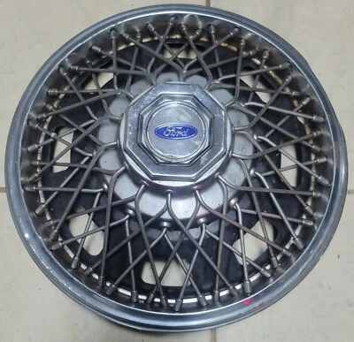 (1) Opción de concesionario OEM 1984-1985 Ford Tempo 13" radios de cable tapacubos cubierta de rueda #0A Foto 1 de 4