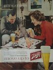 1960 Schlitz beer brown bottle man woman play Monopoly game vintage ad