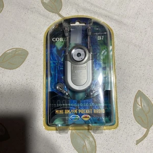 Coby CX-7 Mini AM/FM Pocket Radio DBBS Portable Earphones Neck Strap - Picture 1 of 12