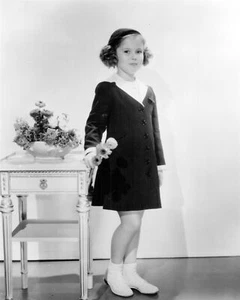 Shirley Temple holding flowers in coat and hat 24x36 inch poster - Picture 1 of 1
