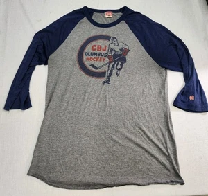 HOMENAJE Columbus Chaquetas Azul NHL CBJ Camisa Raglán XL Hockey Usada en Excelente Condición Azul Gris  - Imagen 1 de 7