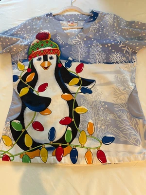 UNIFORM CHRISTMAS SCRUB TOP UA SCRUBS PENQUIN W/COLORED LIGHTS PREOWNED (G-7) - Image 1 of 4