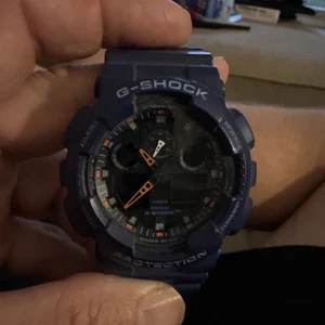 Casio G-Shock GA100L-2A Digital-Analog Herren Armbanduhr - Blau - Bild 1 von 5