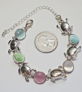 Pulsera de eslabones cabujón de vidrio ojo de gato multicolor tortuga marina y tono plateado 7-10" - Imagen 1 de 2