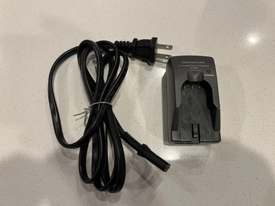Base de cargador de batería de iones de litio original Olympus LI-10C para baterías LI-10B LI-12B Foto 1 de 4