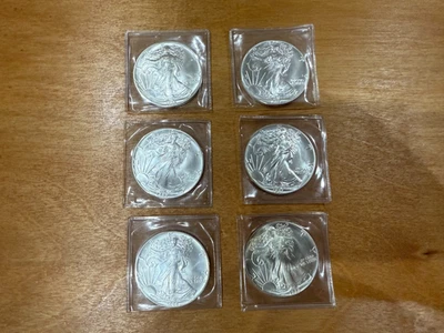 1986 1987 American Silver Eagle Dollar, Uncirculated  - Image 1 of 2