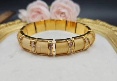 Pulsera elástica Joan Rivers beige crema esmalte y estrás transparente Foto 1 de 4