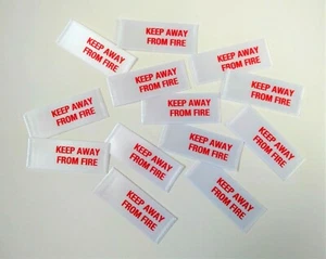 KEEP AWAY FROM FIRE PRE-CUT SEW-IN CLOTHING GARMENT WARNING LABELS TAGS - Picture 1 of 2