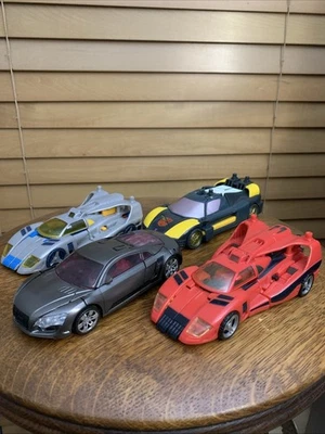 Transformers (4) Swerve, Sideways, Blurr, And Wheel Jack. Highly Collectible - Image 1 of 4