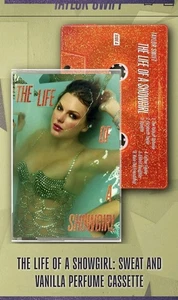 T.S. THE LIFE OF A  SHOWGIRL SWEAT & VANILLA PERFUME ORANGE GLITTER CASSETTE  - Picture 1 of 2