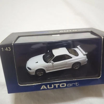 AUTOart Nissan GT-R R34 V-SPEC II 1/43 White Miniature Car Diecast Model - Image 1 of 4