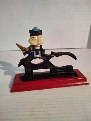 Vintage Cast Iron Soldier Nutcracker Mounted On Red Wooden Base Nut Cracker - Image 1 of 4