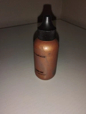 MAC Lustre Drops in the shade Gleam Coat, which is a liquid bronzer/highlighter - Image 1 of 3